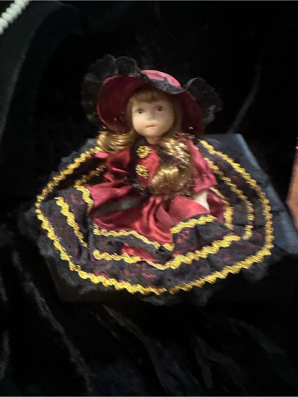 Porcelain Collectible Doll in Burgundy and Black - Picture 2 of 9